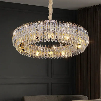 A luxurious decorbites crystal chandelier with clear teardrop crystals and gold-toned accents for modern spaces