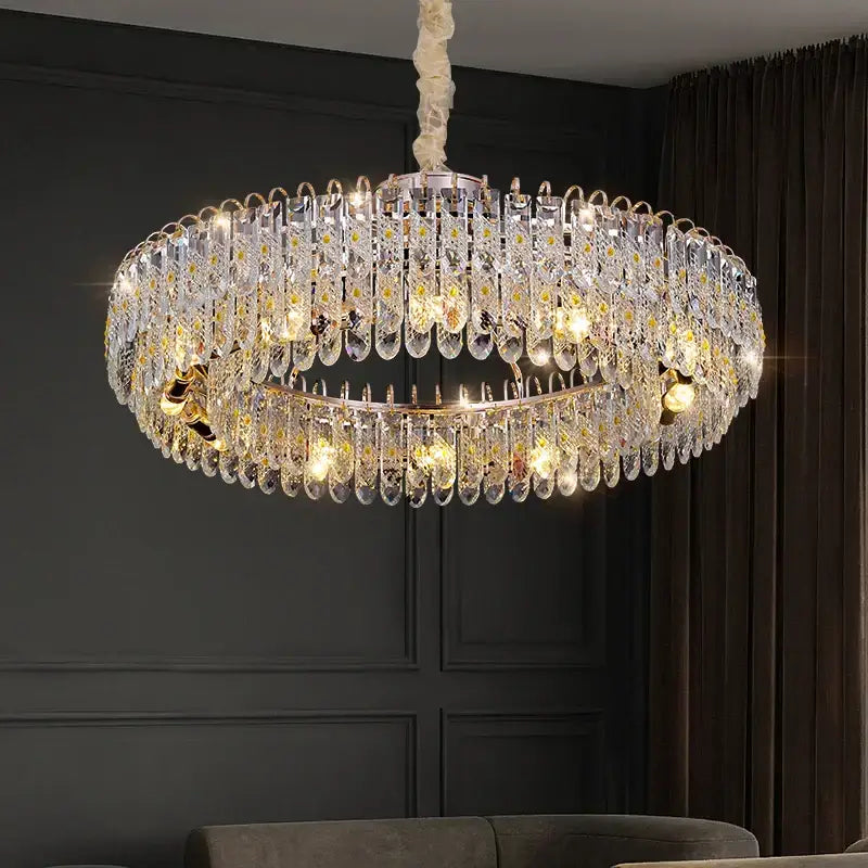 A luxurious gold-toned decorbites crystal chandelier with multiple k9 crystal tiers for modern living spaces