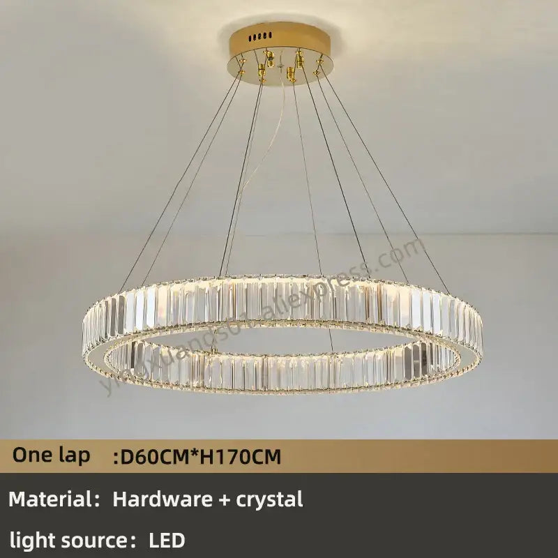 A modern decorbites crystal chandelier with gold-toned mount and clear crystal rods for luxury villa lighting