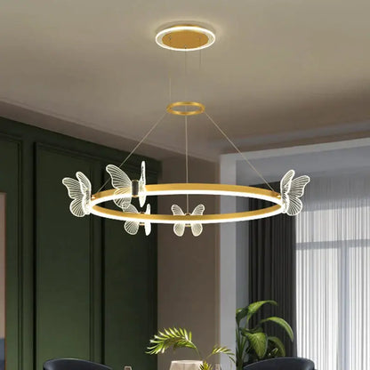 Gold-toned decorbites crystal chandelier with translucent white butterfly accents for modern luxury lighting