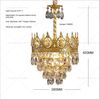 Golden crown-shaped decorbites crystal chandelier with intricate wrought iron detailing and cascading crystal teardrops