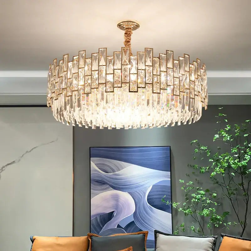 A decorbites crystal chandelier with gold-toned frame and cascading glass prisms for modern luxury lighting