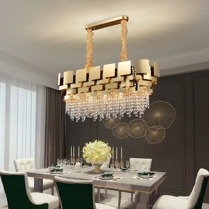 Gold-toned decorbites crystal chandelier with modern geometric design and cascading crystal droplets for luxury lighting
