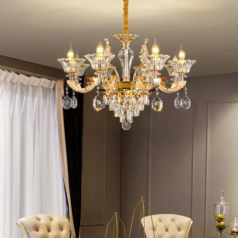 Gold-toned decorbites crystal chandelier pendant with intricate crystal droplets and central glass column for elegant décor
