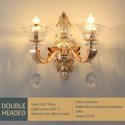 Gold-toned ornate double-headed wall sconce with crystal glass shades and dangling teardrop crystals decorbites crystal chandelier pendant