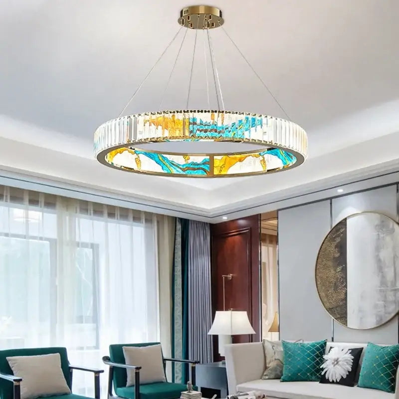DecorBites crystal chandelier pendant lamp with gold mount, clear crystals, and blue yellow stained glass panels