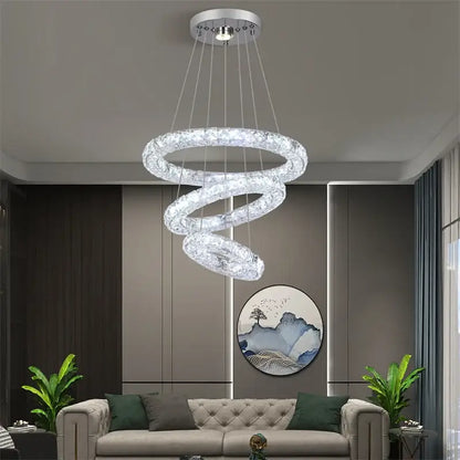 A modern decorbites crystal chandelier pendant lamp with clear crystal accents and silver mount for dining and bedroom
