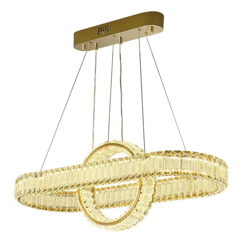 Gold-toned decorbites crystal chandelier with two interlocking crystal rings and sleek rectangular ceiling mount for modern lighting