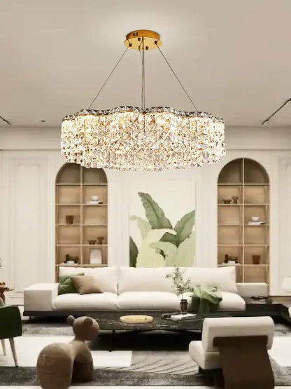 A luxurious gold-toned decorbites crystal chandelier pendant light with circular design and sparkling crystal facets
