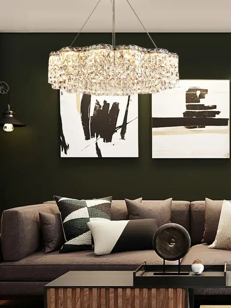 A circular multi-tiered decorbites crystal chandelier pendant light with modern design in clear crystal material