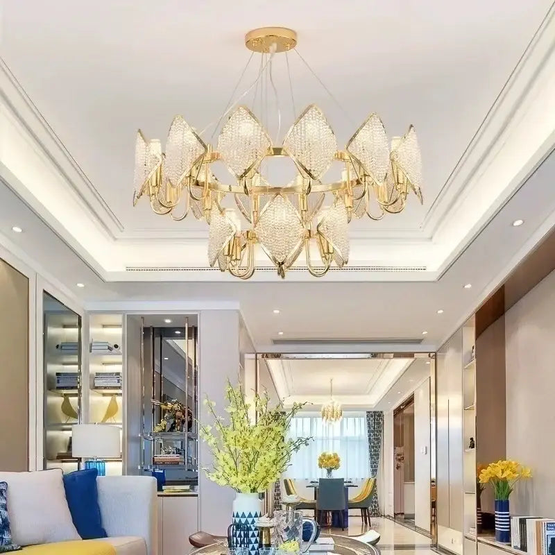 Gold-toned DecorBites crystal chandelier pendant light with faceted crystal shades in a circular petal design for living room decor