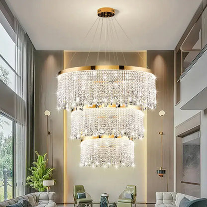 Decorbites crystal chandelier pendant light with cascading crystal strands and gold-toned frame for living room lighting