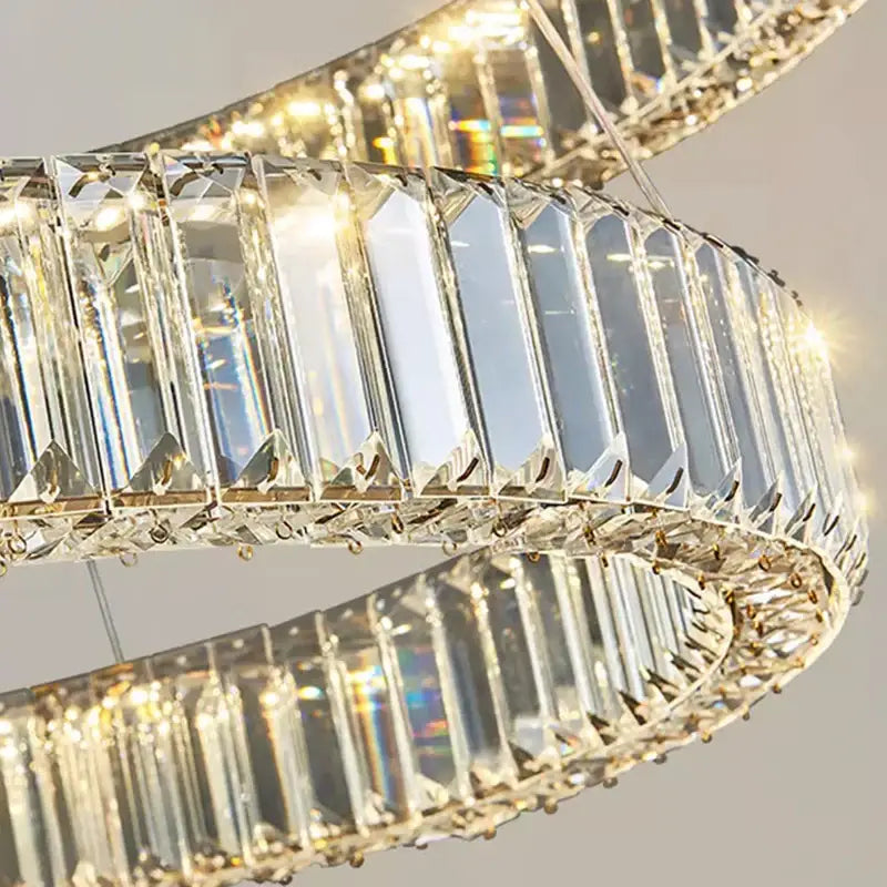 A modern decorbites crystal chandelier pendant light with faceted crystals and gold metal for living room ceiling