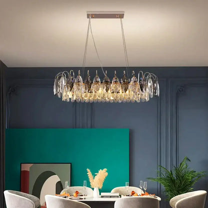 A decorbites crystal chandelier pendant light with clear and dark glass on a metallic frame for indoor use