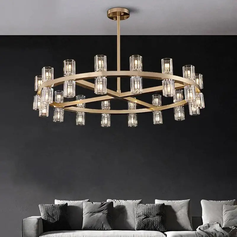 Gold-toned DecorBites crystal chandelier pendant with clear glass cylindrical shades for living and dining room lighting