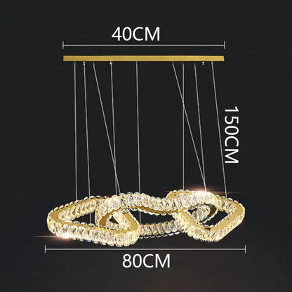 Gold-toned decorbites crystal chandelier pendant light with two interlocking rings adorned with clear crystals for living room