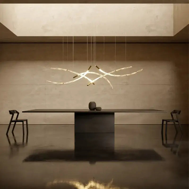 Modern minimalist decorbites crystal chandelier pendant light with slender metallic arms emitting warm glow for living room