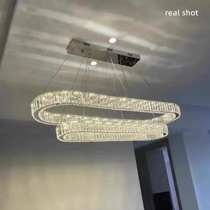 Modern decorbites crystal chandelier pendant light with double-loop chrome design and dimmable embedded led lights