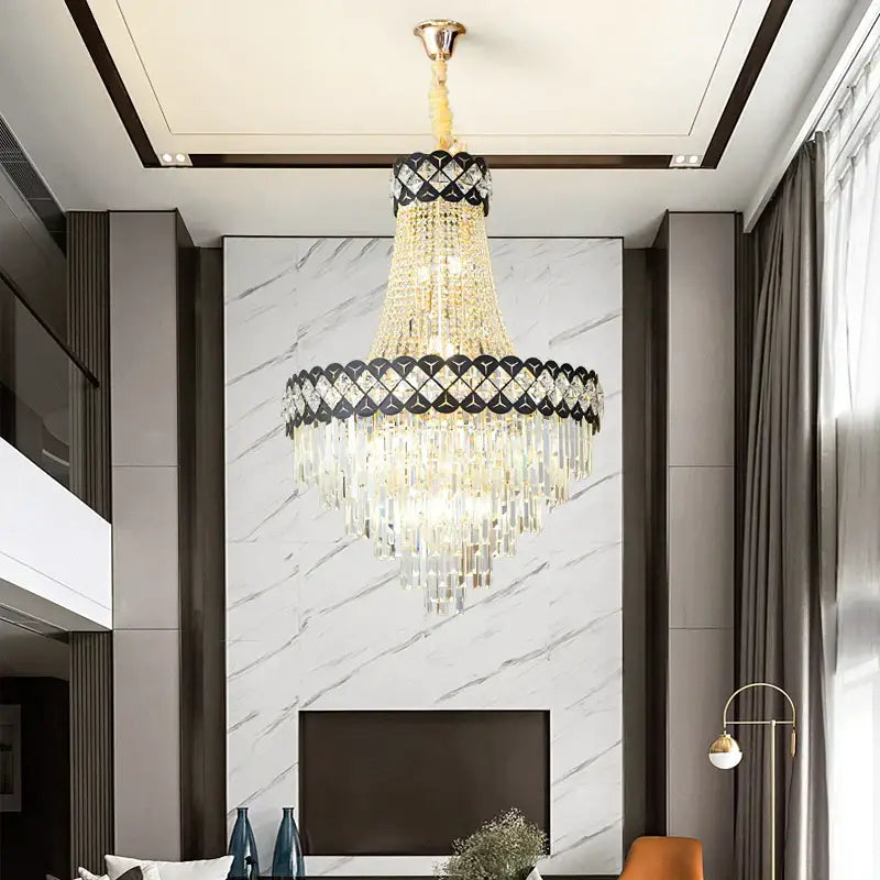 A decorbites crystal chandelier with gold tone, cascading crystal strands and black diamond patterned band for living rooms