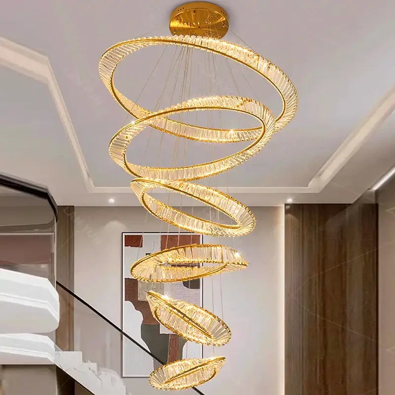Decorbites crystal chandelier featuring a golden spiral design with crystal accents for stair and living room lighting