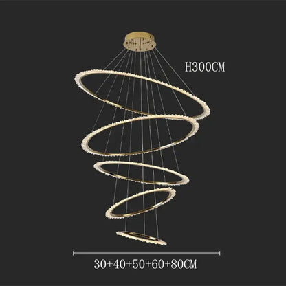 Gold-toned decorbites crystal chandelier with five concentric rings and embedded crystals for modern home lighting
