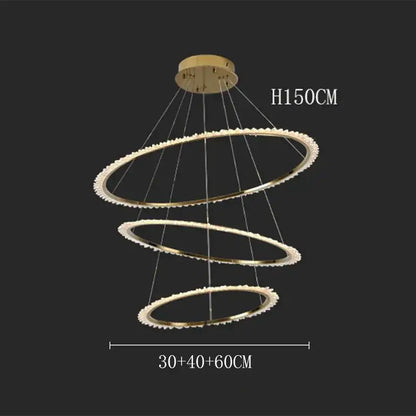 Gold-toned decorbites crystal chandelier with three concentric rings and sparkling crystal accents for modern home lighting