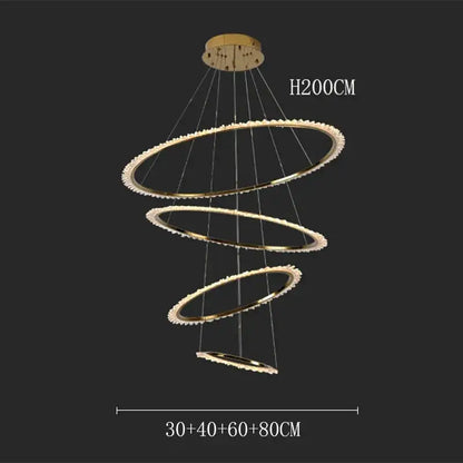 Gold-toned decorbites crystal chandelier with three concentric rings and crystal accents for modern living room lighting