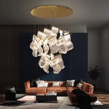 A modern gold-toned decorbites crystal chandelier with translucent glass shades for living room lighting