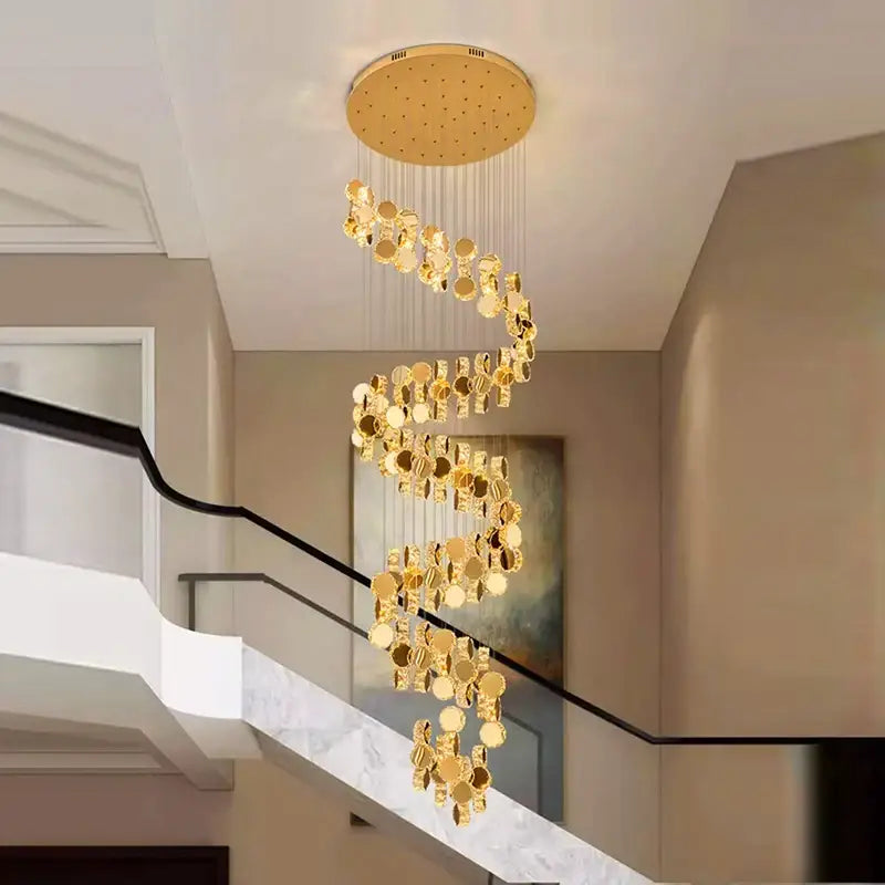 Golden spiral decorbites crystal chandelier with mirrored circular discs suspended from round ceiling fixture for stair lighting