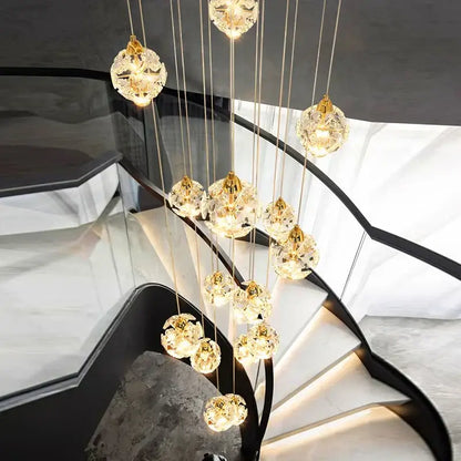 A modern DecorBites crystal chandelier stair pendant lamp with spherical crystal pendants and warm glowing lights
