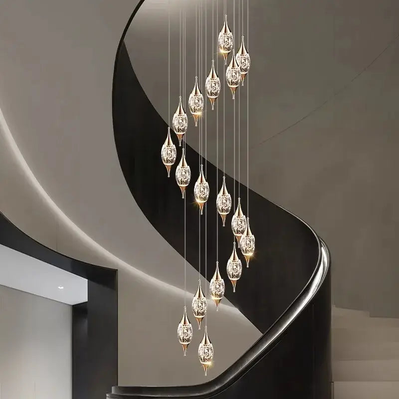 Decorbites crystal chandelier with elegant teardrop-shaped crystal pendants suspended by thin wires for living room lighting