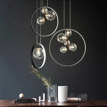 Modern pendant light with clear glass spheres and metallic frames by decorbites crystal chandelier stair above wooden table