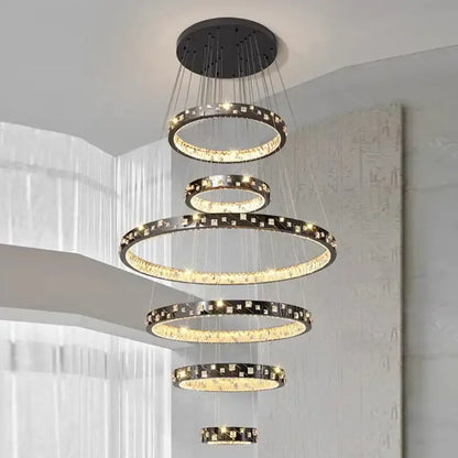 Modern black and gold DecorBites crystal chandelier stair pendant with tiered design and crystal accents for living room lighting