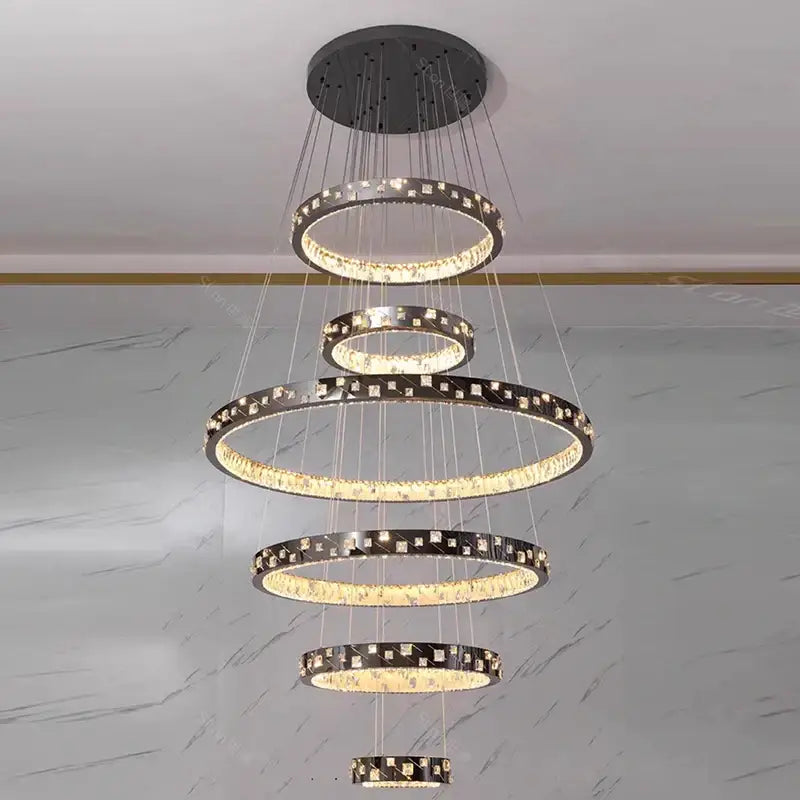 Modern silver-toned decorbites crystal chandelier with cascading crystal rings and led lighting for stair pendant use