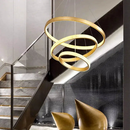 Golden spiral ring pendant lamp with sleek modern design by decorbites crystal chandelier for stair lighting