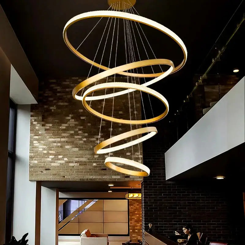 Golden spiral DecorBites crystal chandelier pendant lamp with multiple concentric rings for stair or living room lighting