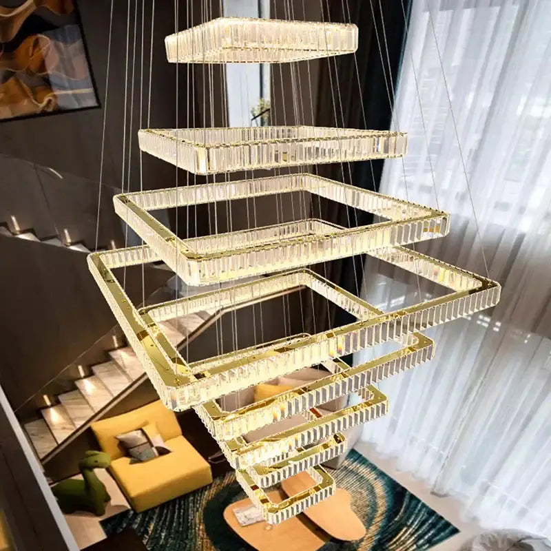 A modern DecorBites crystal chandelier stair pendant lamp with cascading rectangular crystals and gold-toned accents