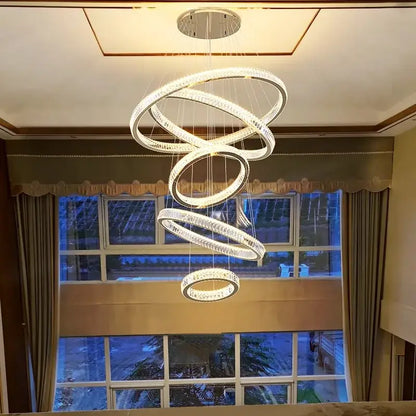DecorBites crystal chandelier stair pendant featuring modern spiral rings made of clear crystal and metal for living room lighting