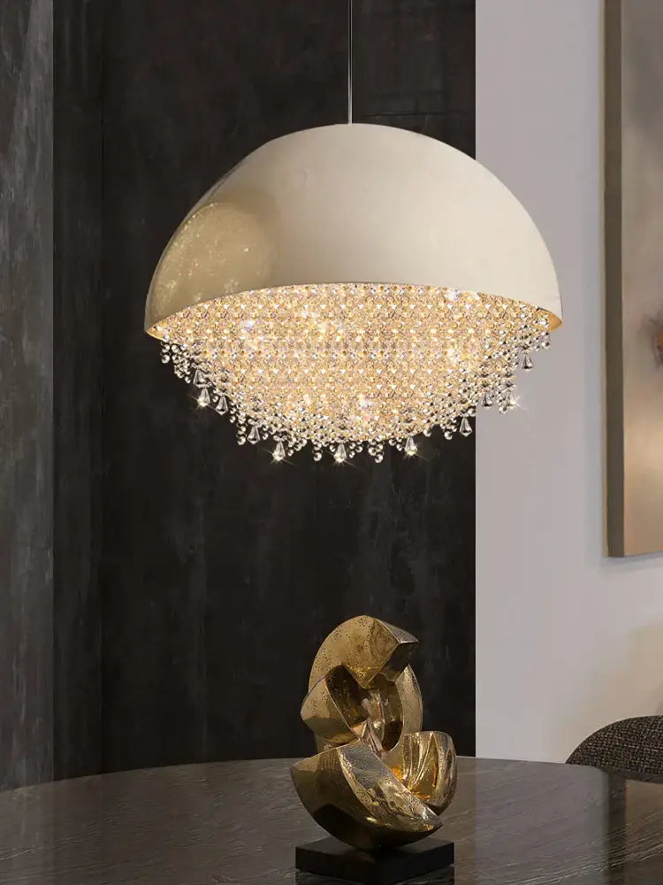 Cream-colored dome pendant light with cascading crystal droplets in decorbites crystal chandelier for living room