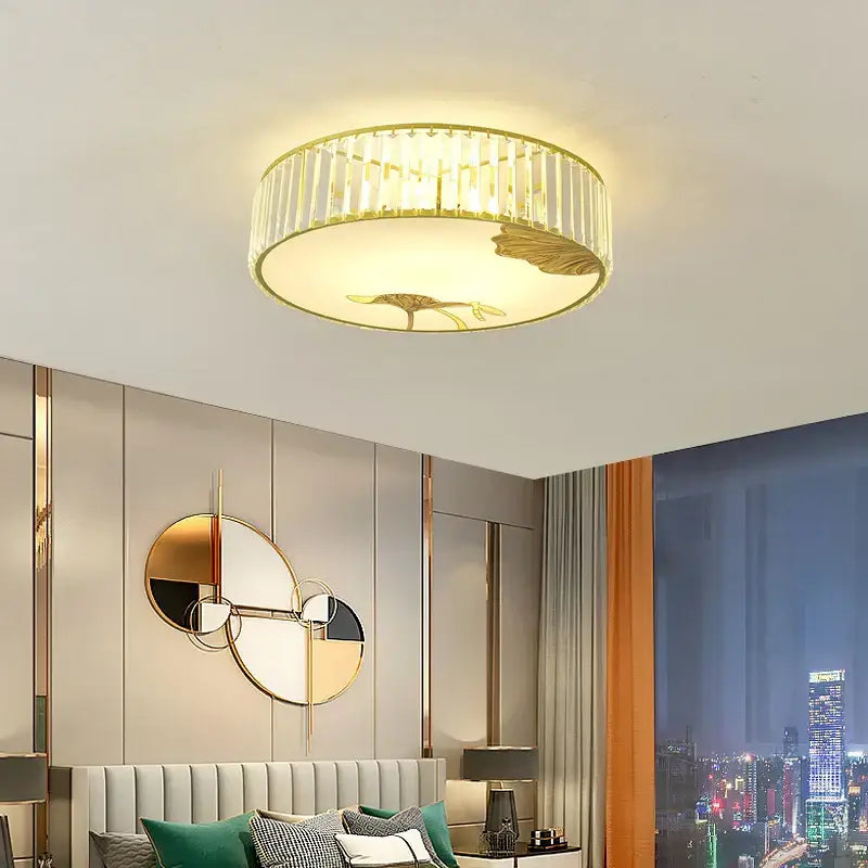 Gold-toned decorbites crystal chinese lotus ceiling light with vertical crystal accents and central leaf motif for living room