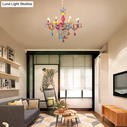 A vibrant multi-color DecorBites™ crystal decorated kids chandelier with pastel and bright hues for kindergarten use