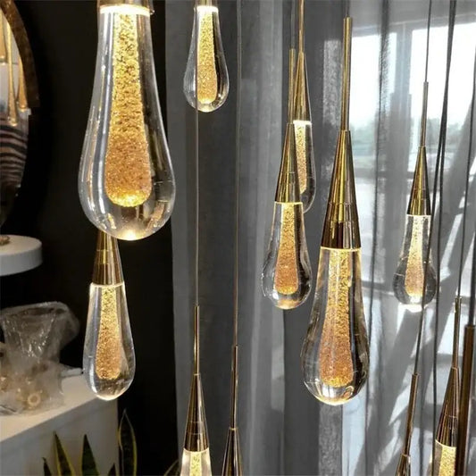 Teardrop-shaped decorbites crystal drop chandelier with golden glass and brass fixtures for dining room lighting