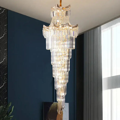 Decorbites crystal duplex chandelier with gold-toned metal and cascading clear glass prisms for staircase lighting