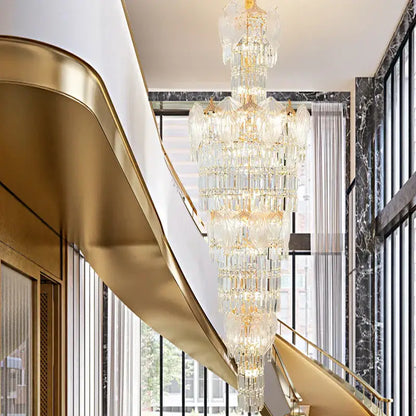 A multi-tiered decorbites crystal european long chandelier with gold-toned metal accents for living room lighting