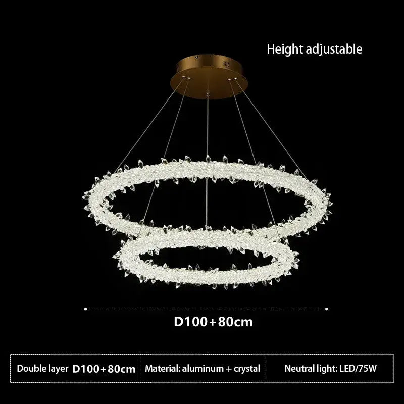 A modern decorbites crystal flower led chandelier with gold-toned mount aluminum rings and clear crystals for dining room