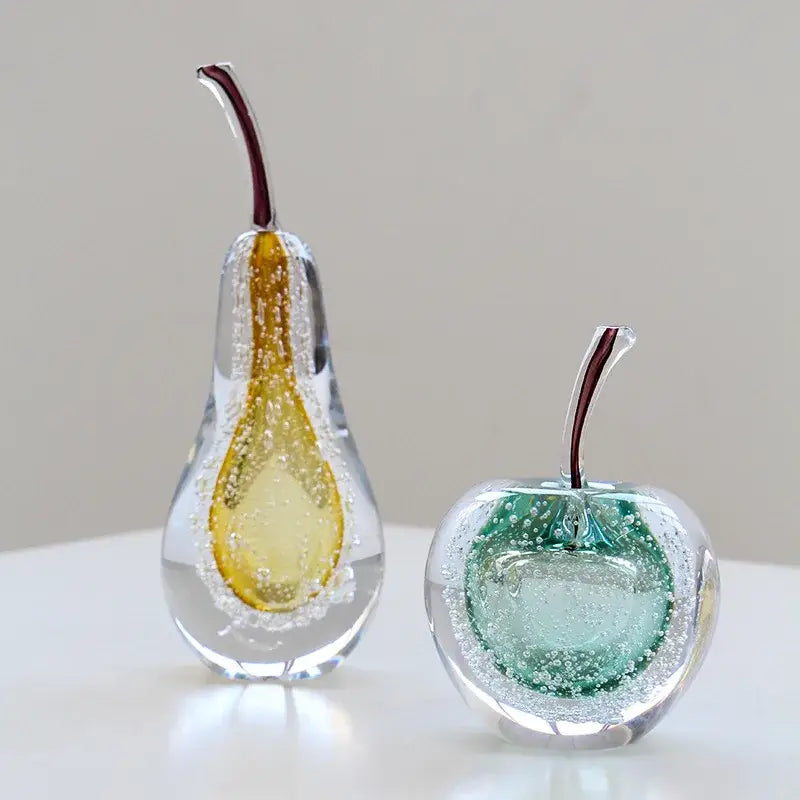 Decorbites crystal glass fruit sculptures featuring a yellow pear and green crystal glass apple with embedded bubbles for decor