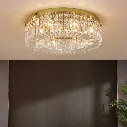 Gold-toned DecorBites™ crystal LED chandelier ceiling light with cascading prisms for modern dining room ceiling light