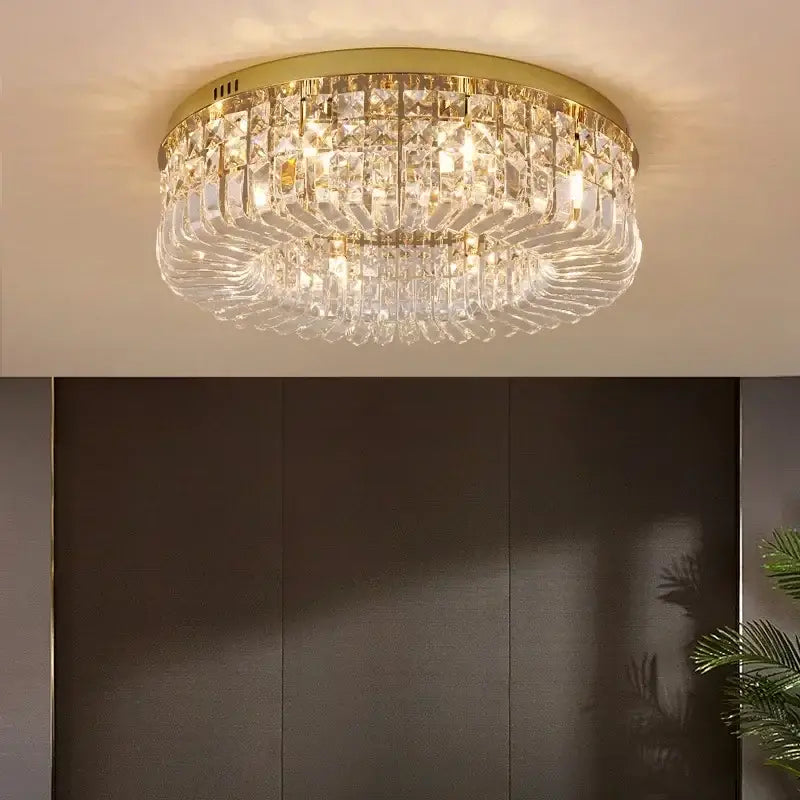 Gold-toned DecorBites™ crystal LED chandelier ceiling light with cascading prisms for modern dining room ceiling light