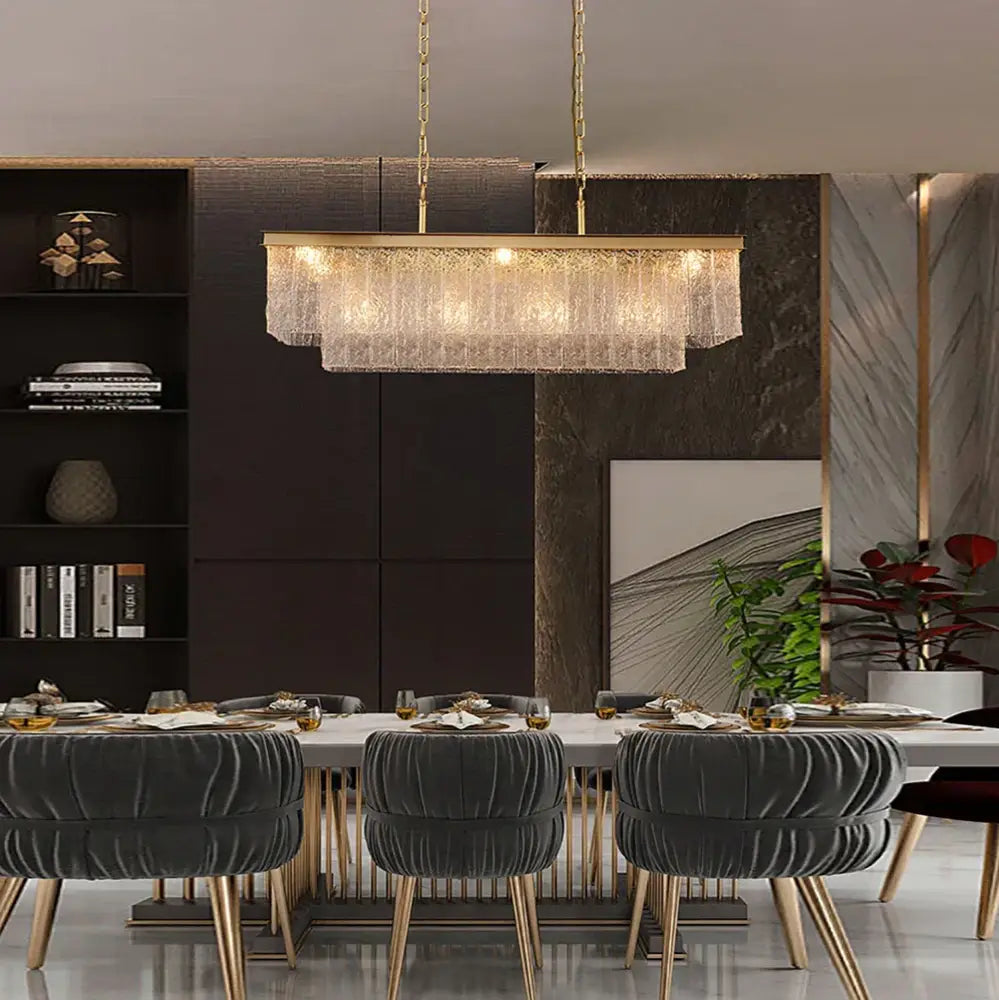 Gold-toned decorbites crystal led chandelier with rectangular frame and cascading crystal fringe for dining room lighting