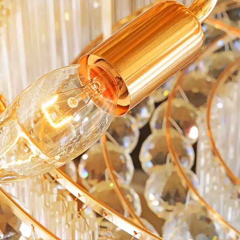 Golden filament bulb with clear glass in polished brass socket of decorbites crystal led chandelier ceiling lamp
